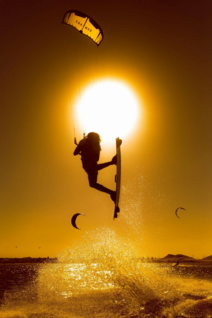 KiteGuy jumping into the sun
